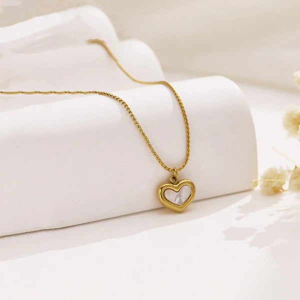 Adore You necklace by everray on a white fabric background