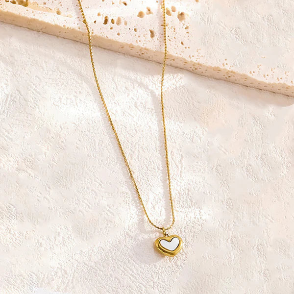 Adore You necklace with by everray on a textured beige surface