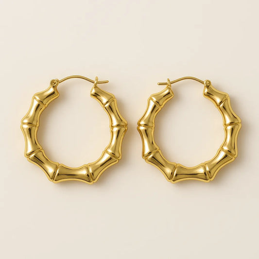 Bamboo hoop earrings on a beige background