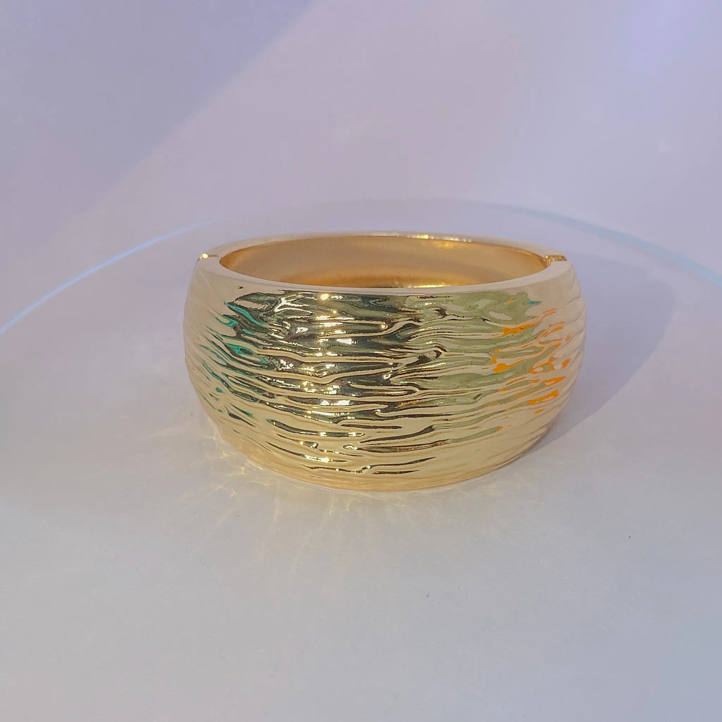 Golden Ripple Cuff By Everray on a white background