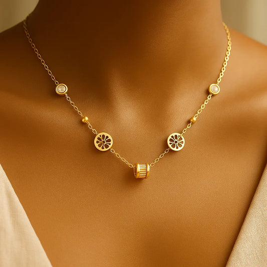 A dusky model wearingGold-toned necklace featuring lotus-inspired medallions, bezel-set crystals, and a center baguette charm on adjustable chain.
