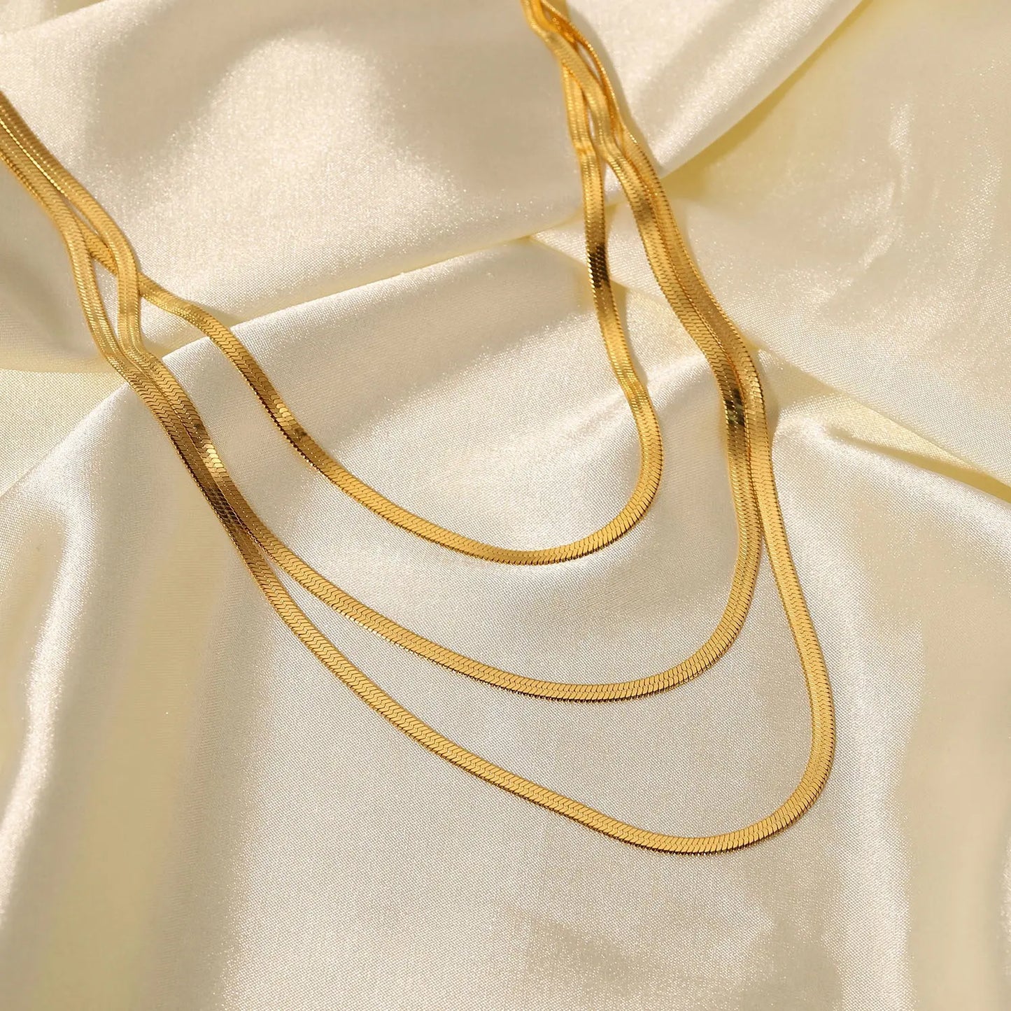 Sunehri Silhouettes- Layered Necklace on a cloth shot by everray.in