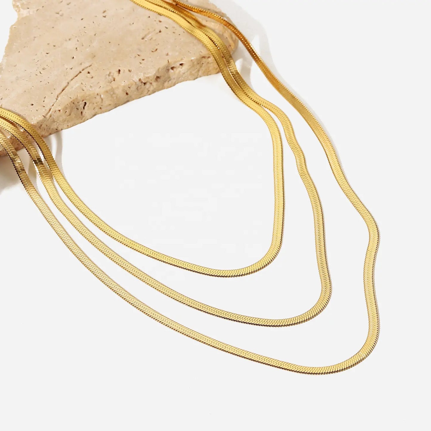 Sunehri Silhouettes- Layered Necklace on a rock by everray.in