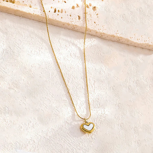 Adore You  necklace with by everray on a textured beige surface