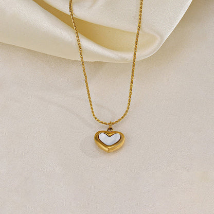 Adore You  necklace by Everray on a beige fabric background