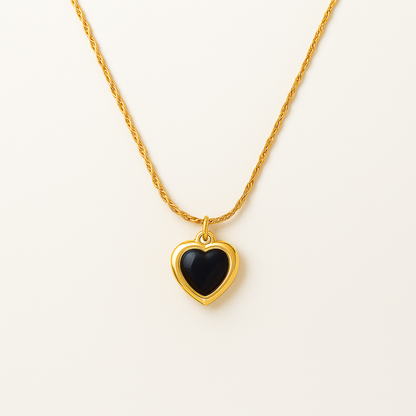 Adore You Black necklace with a black heart pendant on a white background