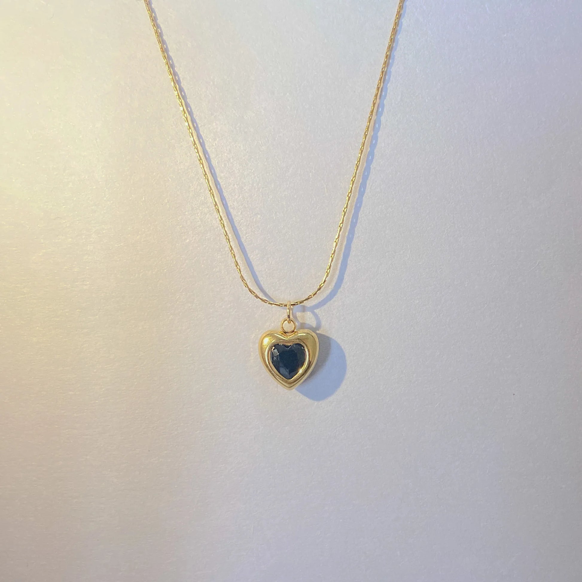  Adore You Black Necklace with a heart-shaped pendant on a light background