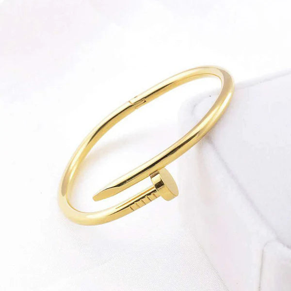Gold bracelet on a white background