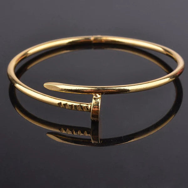 Gold bracelet on a black background