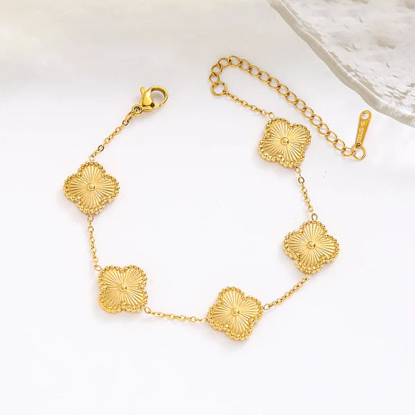 Gold clover Bracelet by everray with square links on a white background