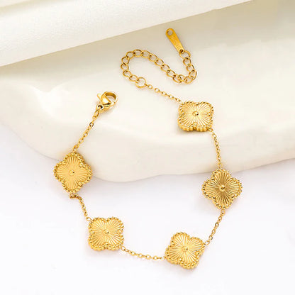 Gold clover Bracelet by everray  on a white background