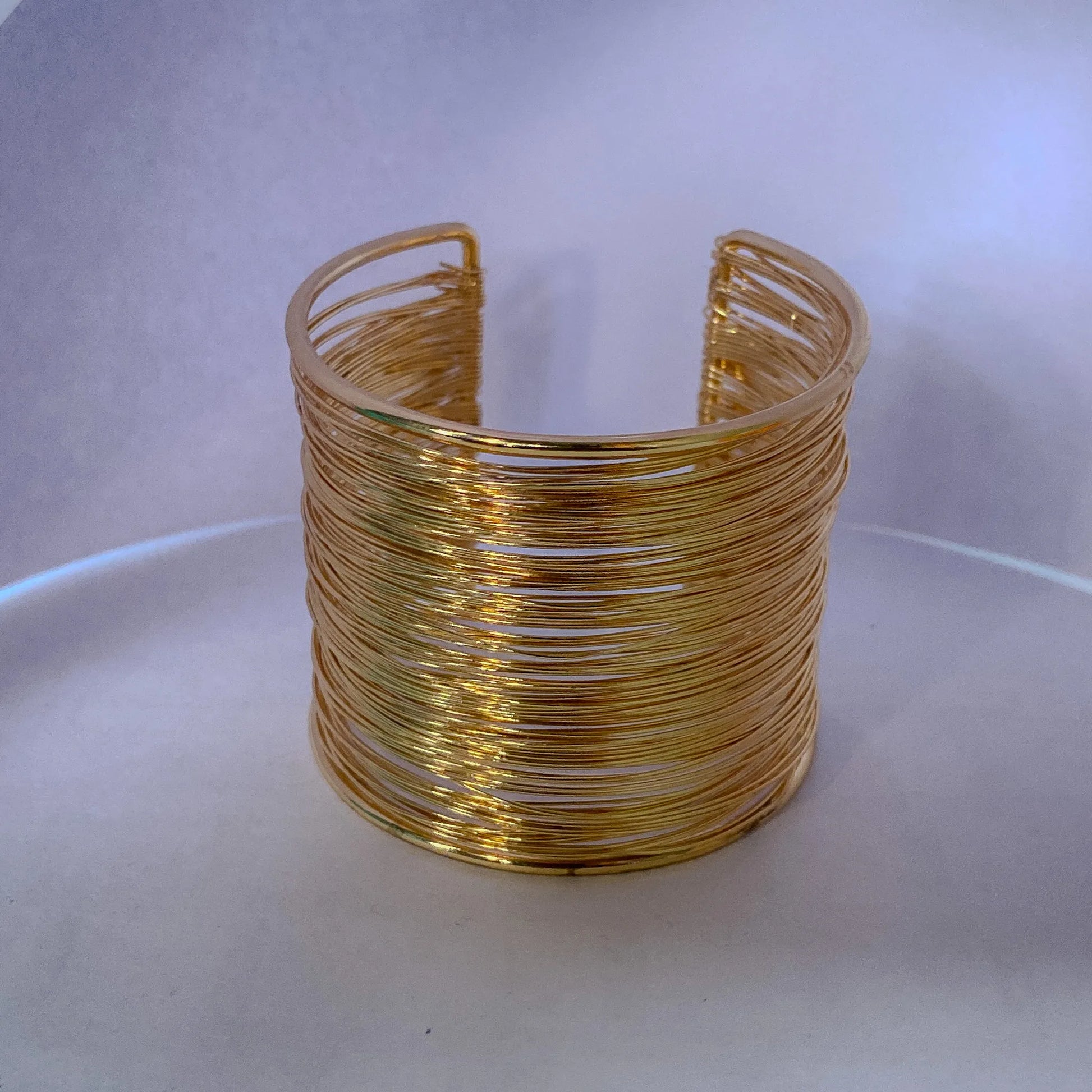 Gold wire cuff bracelet  by everray on a white background