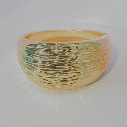 Golden Ripple Cuff By Everray on a white background