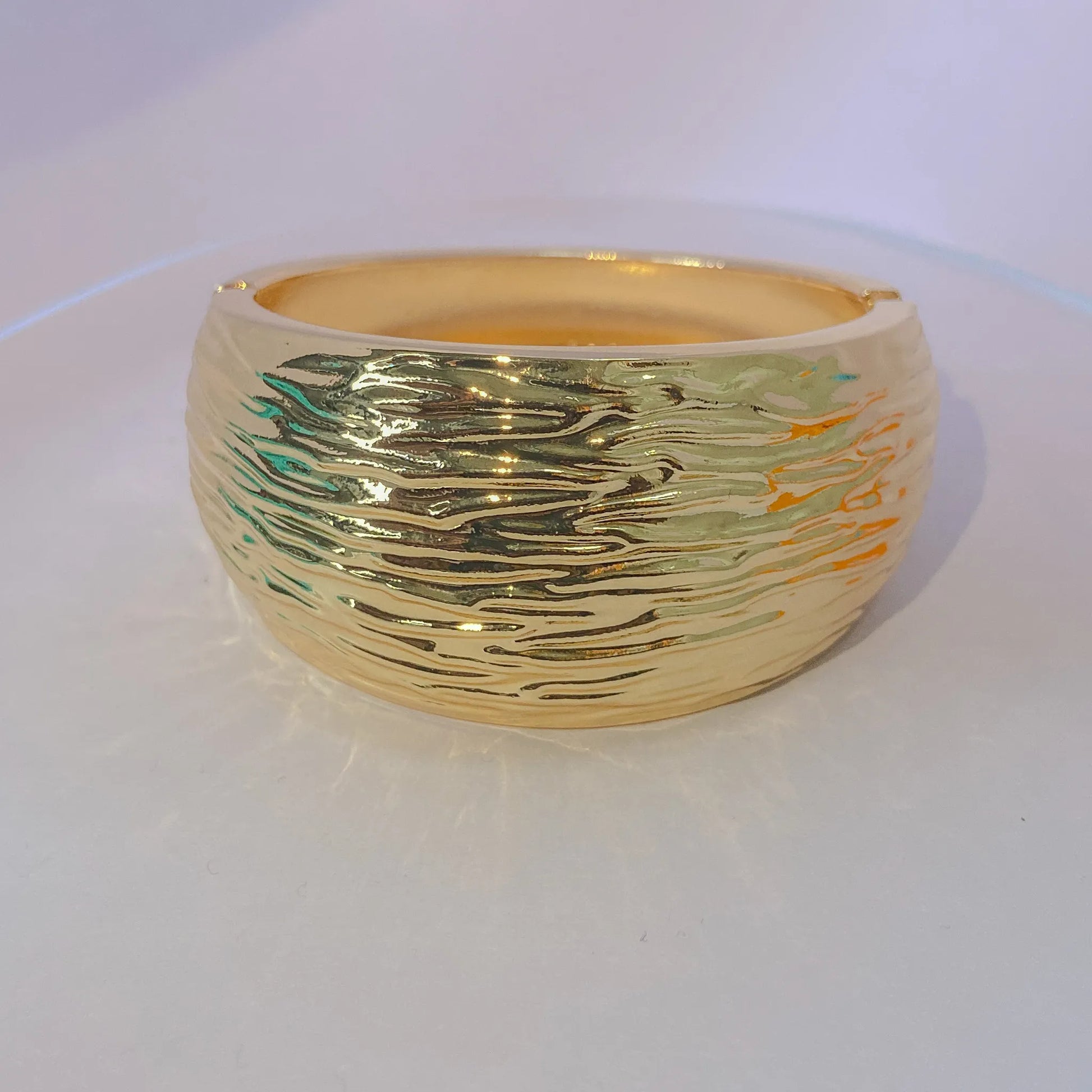 Golden Ripple Cuff By Everray  on a white background