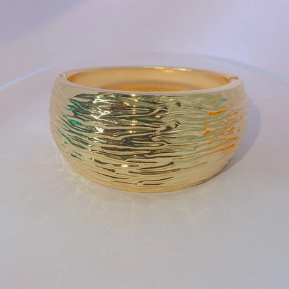 Golden Ripple Cuff By Everray  on a white background