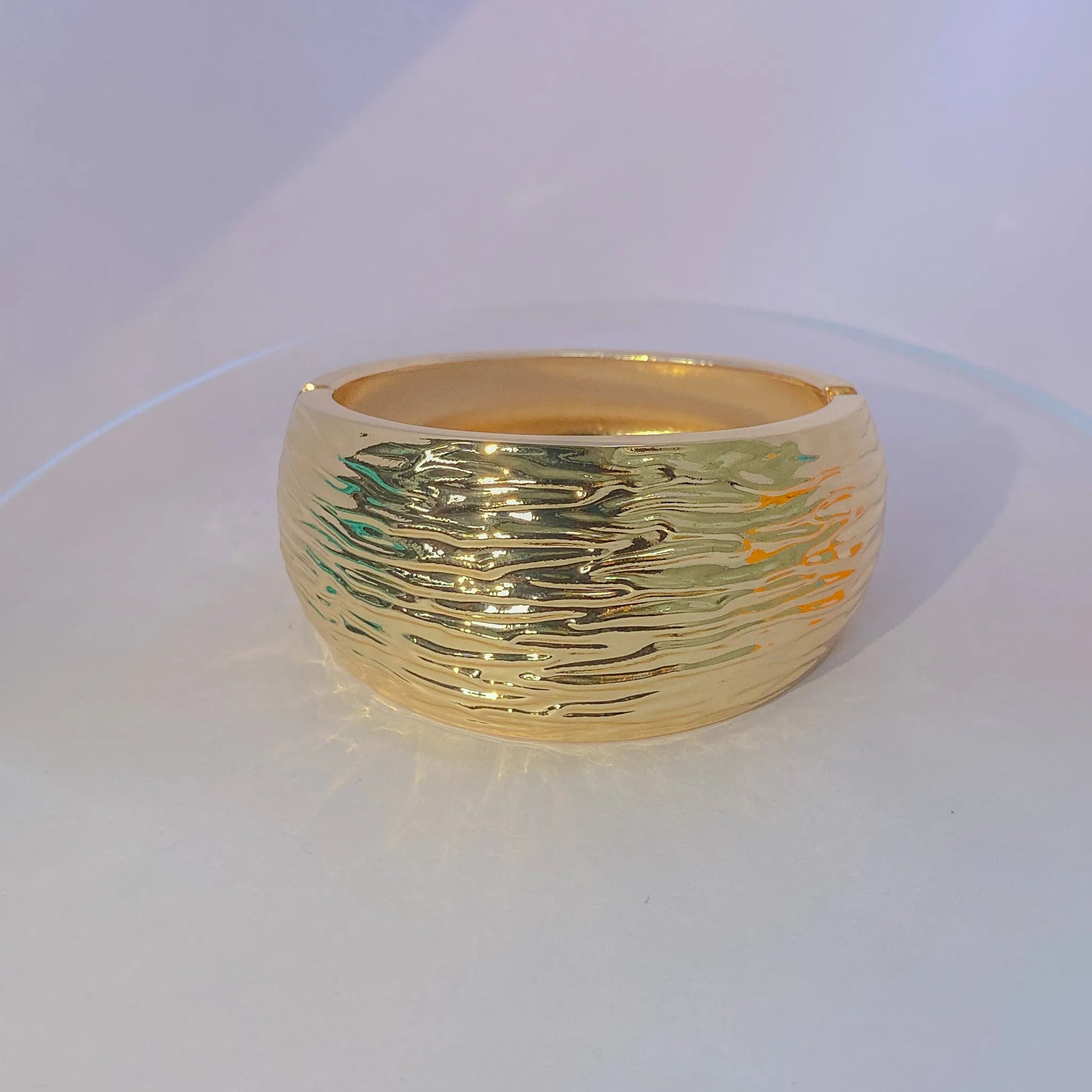 Golden Ripple Cuff By Everray on a white background