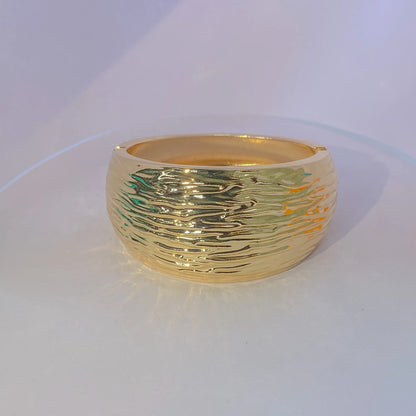 Golden Ripple Cuff By Everray on a white background