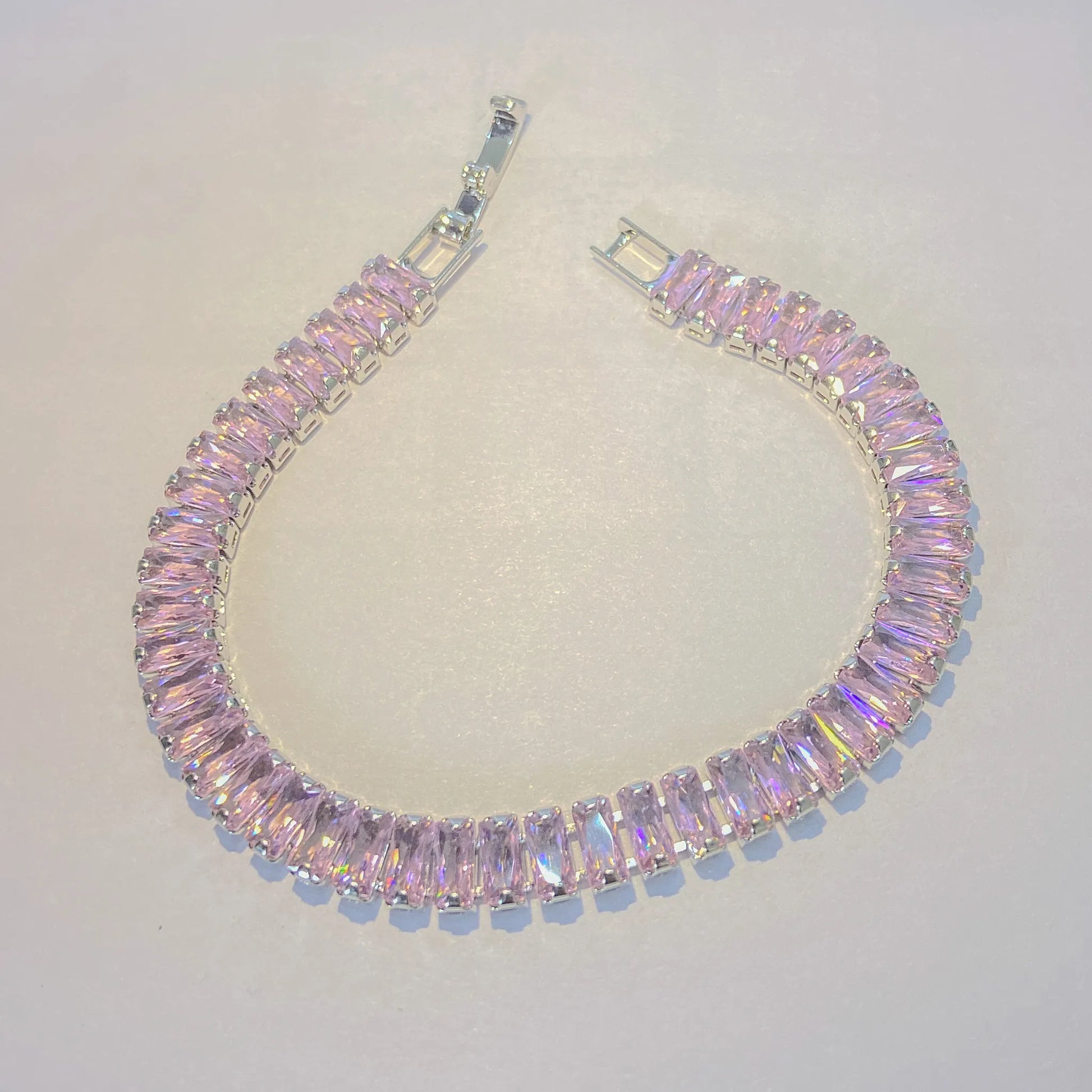 Pink SIlver tennis bracelet By everray on a light gray background