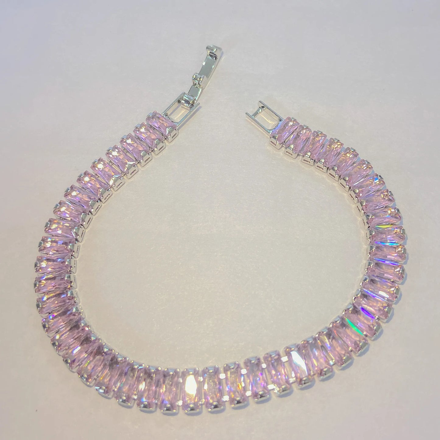 Pink SIlver tennis bracelet By everray on a light gray background