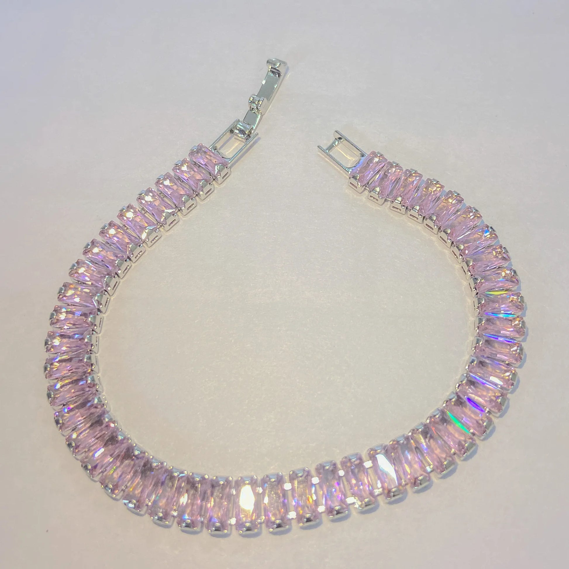 Pink SIlver tennis bracelet By everray on a light gray background
