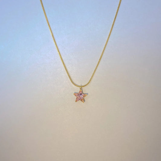 Pink Star Pendant Necklace by everray on a white surface
